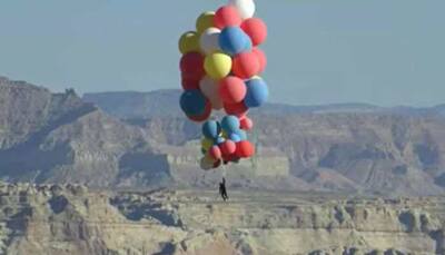 Illusionist David Blaine flies 24,000 feet into the sky with 52 helium balloons - WATCH