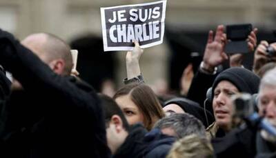 French magazine Charlie Hebdo uncowed after attacks - but now with bodyguards