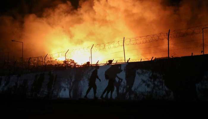 Thousands homeless after fire guts migrant camp on Greek island