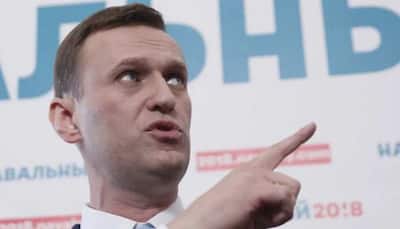 Russian politician Alexei Navalny's condition improving, police guard stepped up: German media