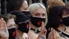 Bare-chested women lock themselves to UK parliament in climate protest