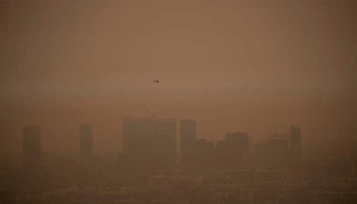 Thousands of firefighters battle US West Coast blazes amid 'overwhelming' ruin