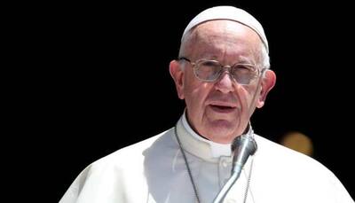 Pope Francis keeps his distance at audience over COVID concerns