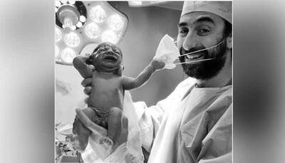Positivity in 2020! Viral picture of newborn baby removing doctor’s mask wins hearts