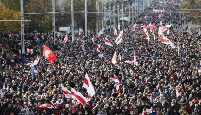 Tens of thousands march in Belarus&#039; capital Minsk despite firearms threat