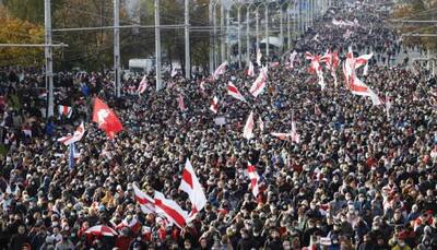 Tens of thousands march in Belarus' capital Minsk despite firearms threat