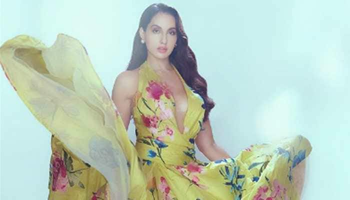 Nora Fatehi oozes oomph in a floral Marchesa gown, walks out in style from her vanity van - Watch viral video