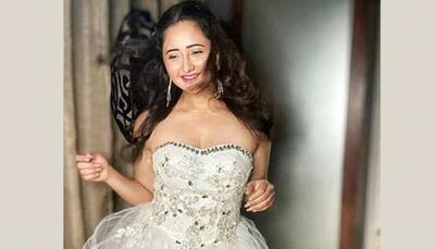 Bigg Boss 13 contestant Rashami Desai's bold and beautiful photoshoot in all-whites raises the hotness bar!