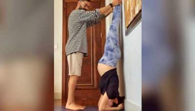 Pic of preggers Anushka Sharma practicing yoga asana with husband Virat Kohli's support is the best thing on internet today!