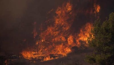 California firefighters battle to tame wildfire