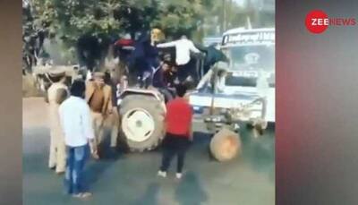 Farmers try to intimidate policemen with stunts on a tractor - Watch