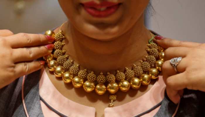 Gold declines Rs 102 to Rs 48,696 per 10 grams; silver marginally lower