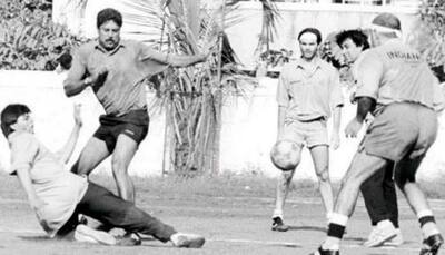 Spot Shah Rukh Khan in this old pic with Kapil Dev and others. Can you?