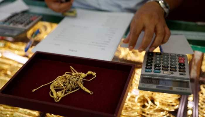 Gold rises Rs 514 to Rs 50,297 per 10 gram; silver zooms by Rs 2,249