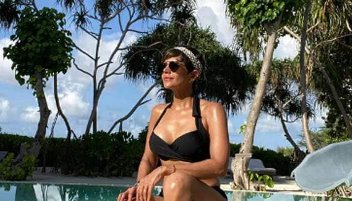 Mandira Bedi flaunts her washboard abs in throwback bikini pic; misses sun, sea and sand!