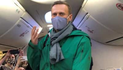 Kremlin critic Alexei Navalny lands in Russia, flying home despite arrest threat