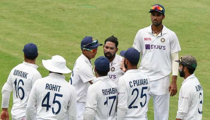 Mohammed Siraj (centre) is congratulated by his teammates after picking up a wicket. (Source: Twitter)