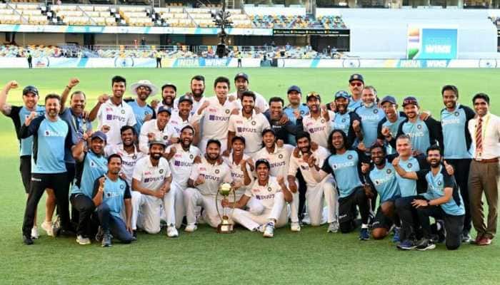 Team India pose with the Border-Gavaskar Trophy at the Gabba after completing a 2-1 series win. (Source: Twitter)
