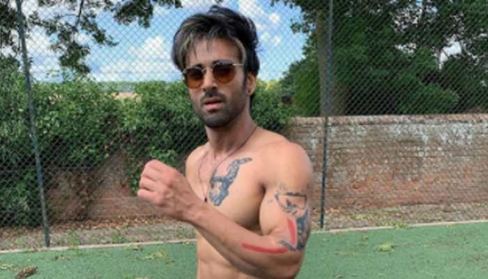 Does Pulkit Samrat roam naked in his vanity van? His latest pic says so!