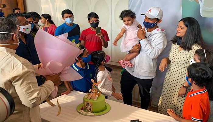 Stand-in skipper Ajinkya Rahane with his wife and daughter are welcomed back by his family. (Photo: PTI)