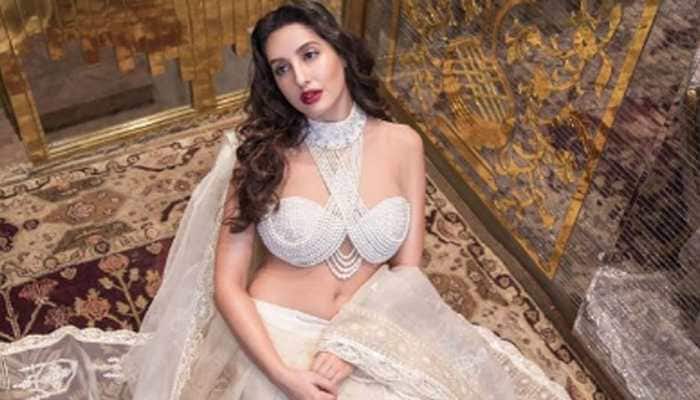 Nora Fatehi&#039;s sensuous avatar in Abu Jani-Sandeep Khosla organza saree with pearl-crystal blouse hits internet, fans say &#039;wow&#039;!