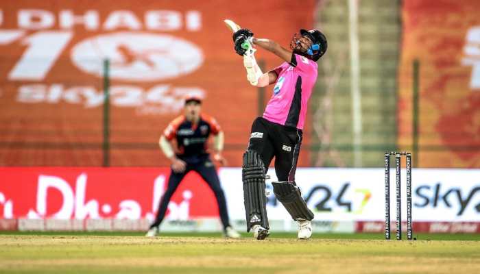 Pune Devils' Muhammad Amir goes for a big one against Delhi Bulls.