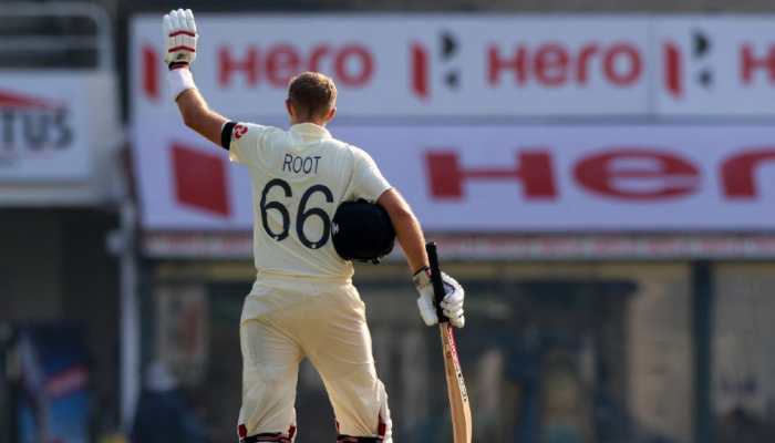 England skipper Joe Root celebrates after completing his century in his 100th Test in Chennai against India. (Source: Twitter)