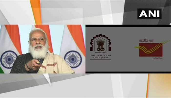 PM Narendra Modi unveils postage stamp on Gujarat High Court&#039;s Diamond jubilee event