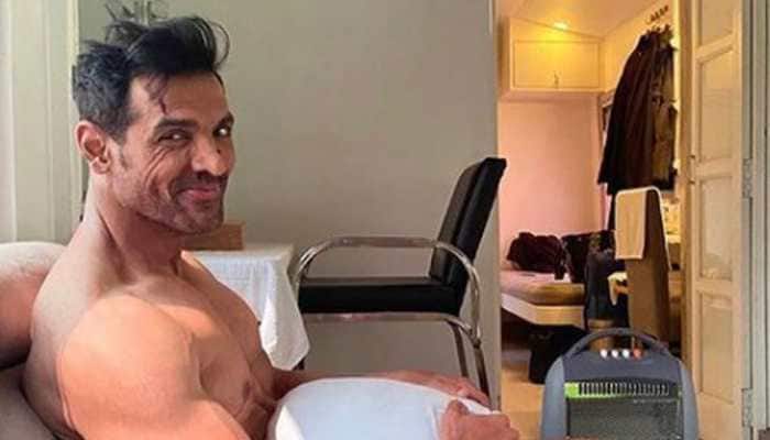 John Abraham ditches clothes, covers-up with a pillow in this new pic from movie sets!