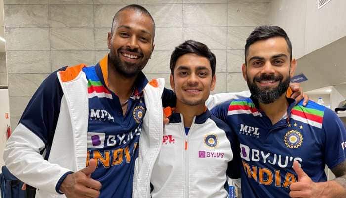 Debutant Ishan Kishan (centre) poses with Hardik Pandya (left) and skipper Virat Kohli after the 2nd T20 against England. (Source: Twitter)