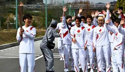 Tokyo Games: Olympics torch relay starts as North Korea launches missiles 