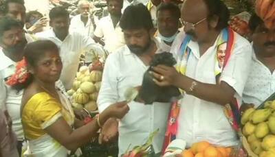 TN polls: PMK candidate against Udhayanidhi Stalin selling mangoes to woo voters in Chepauk constituency