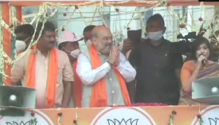West Bengal Assembly election: Amit Shah eats lunch at rickshaw puller&#039;s house in Domjur, holds roadshow in Singur