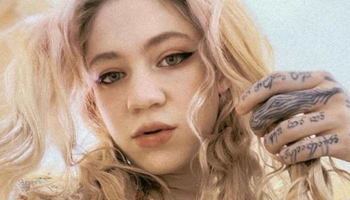 Elon Musk's girlfriend Grimes shares picture featuring tattoo of 'beautiful alien scars'