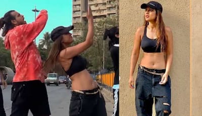 Nia Sharma dons a black sports bra, ripped jeans and dances on Mumbai roads with choreographer - Watch