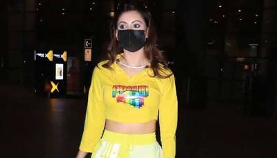 Urvashi Rautela amps up airport look, turns heads in yellow crop top and athleisure pants - Pics