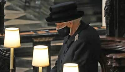 Queen Elizabeth stands alone as Prince Philip is laid to rest
