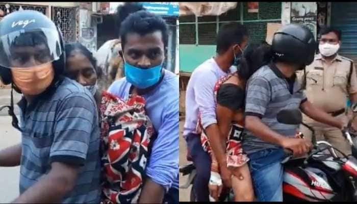 With no ambulance available, son takes COVID positive mother&#039;s body for cremation on bike in Andhra Pradesh