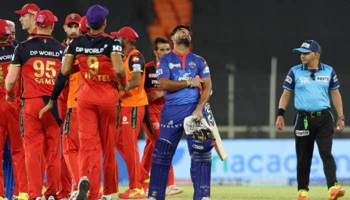 Delhi Capitals skipper Rishabh Pant (right) after failing to get his team across the line against Royal Challengers Bangalore in the IPL 2021 match in Ahmedabad. (Photo: PTI)