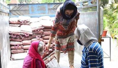 Tisca Chopra's parents help her out to donate rice packets to people in need