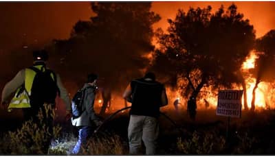 Greek firefighters try to narrow down blaze near Athens