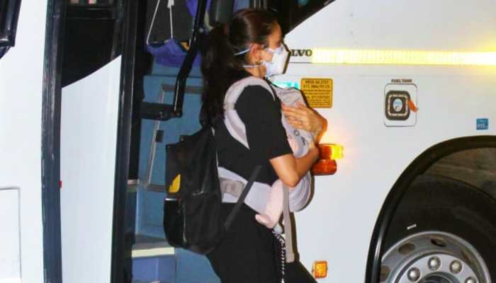 Virat Kohli's wife Anushka Sharma holds daughter Vamika at the Mumbai airport ahead of their departure for UK for the World Test Championship Final. (Photo: Viral Bhayani)