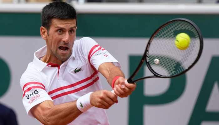 World No. 1 Novak Djokovic returns to 19-year-old Lorenzo Musetti of Italy in their French Open 2021 fourth round clash in Paris. (Photo: PTI)