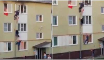 Real-life heroes: Men form human chain to save children trapped in burning building