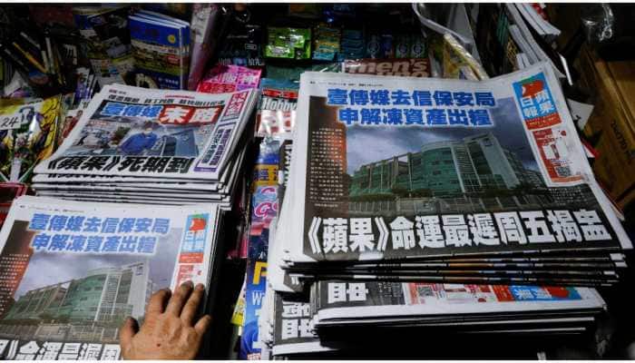 Hong Kong police arrest Apple Daily lead writer and reporter under national security law