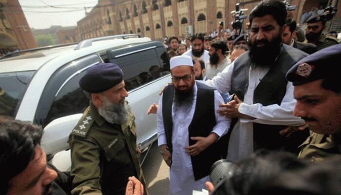Massive raids in Pakistan's Punjab province after blast outside Hafiz Saeed's house, several detained