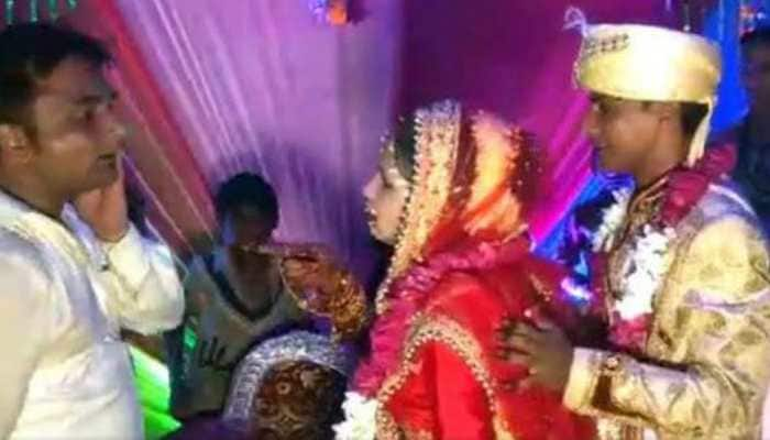 Viral video: Dulhan ka &#039;Thappad&#039;! Bride slaps a man on-stage who tries to lift her, &#039;clueless&#039; groom has an epic reaction - Watch