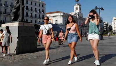 Spain scraps outdoor mask-wearing rule, but many stay covered up