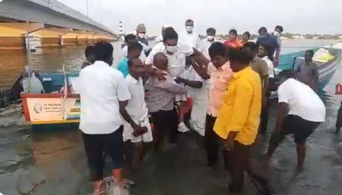 Tamil Nadu minister rides fishermen in ankle-deep water to keep white shoes, dhoti clean - Watch