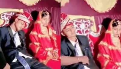 Dulha falls asleep on stage with bride sitting next to him, confused baaratis try to wake him up - Watch
